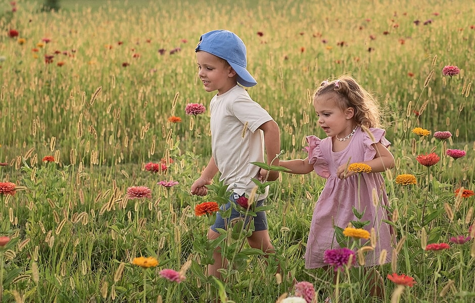 Dr. Williamson's children running through a field