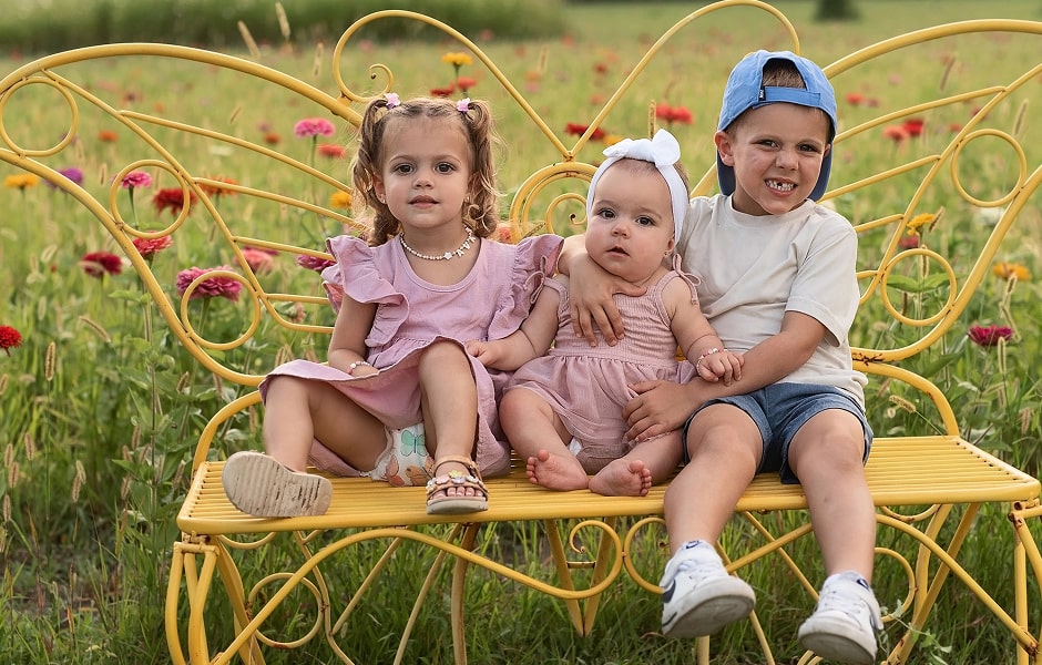 Dr. Williamson's children sitting on a bench